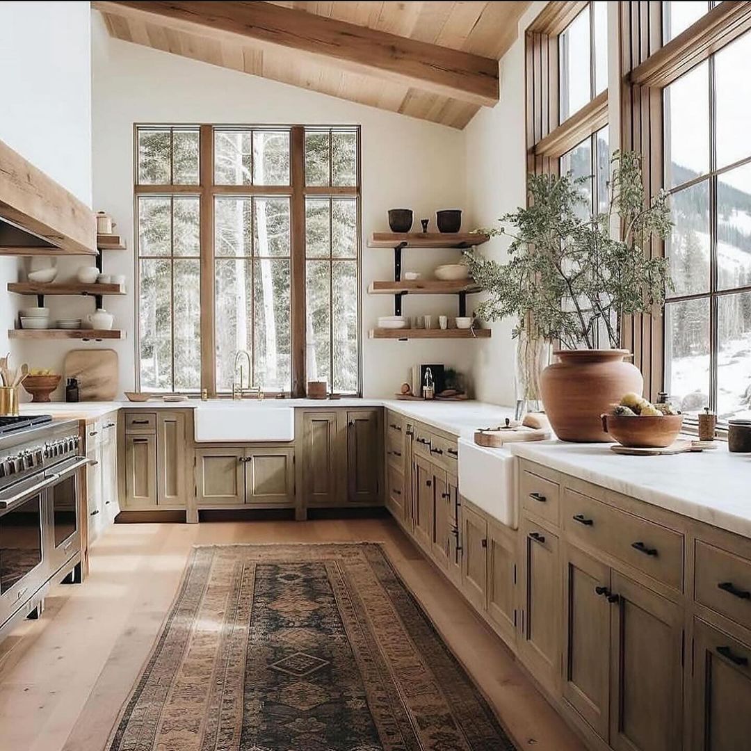 A cozy kitchen space with panoramic views of snowy mountains