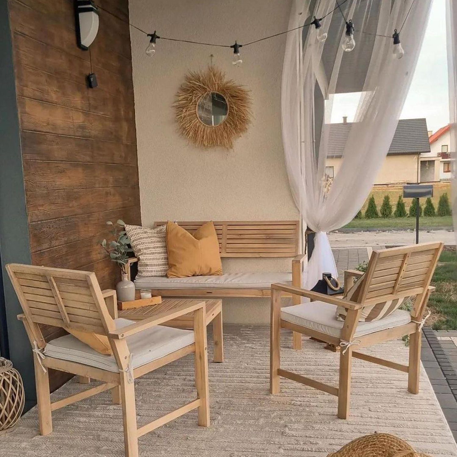 Cozy outdoor patio with neutral tones and wooden furniture