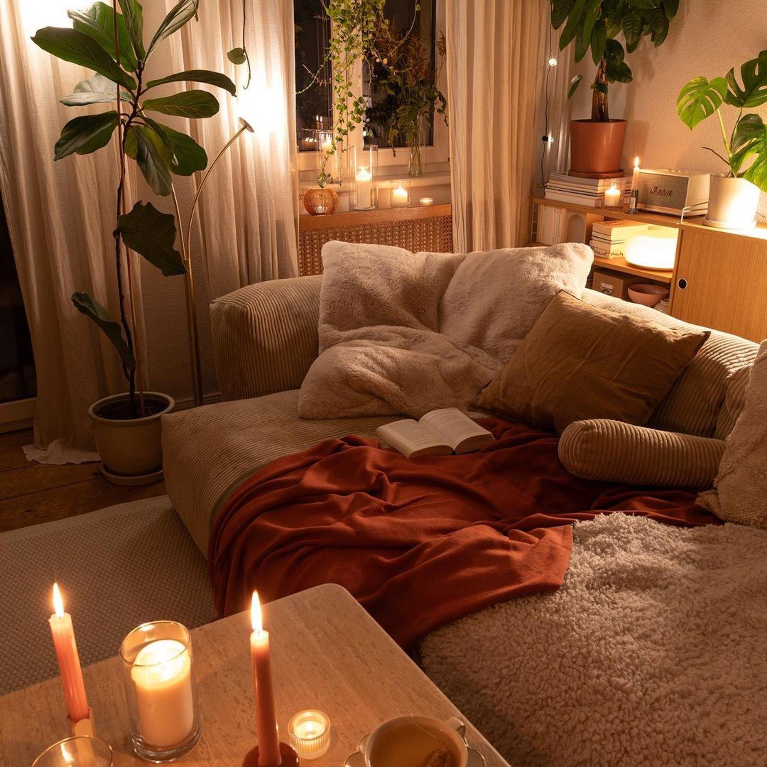 Cozy reading nook with warm lighting and greenery