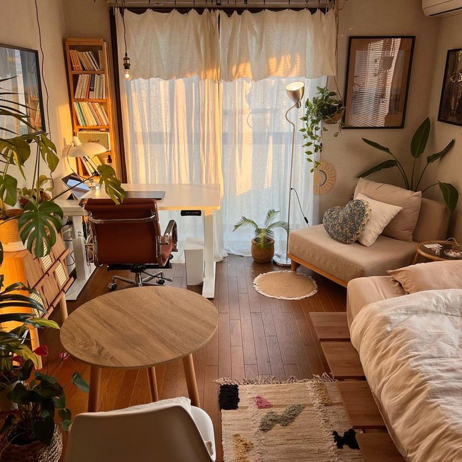 Cozy and inviting small living room with plenty of greenery and natural light.