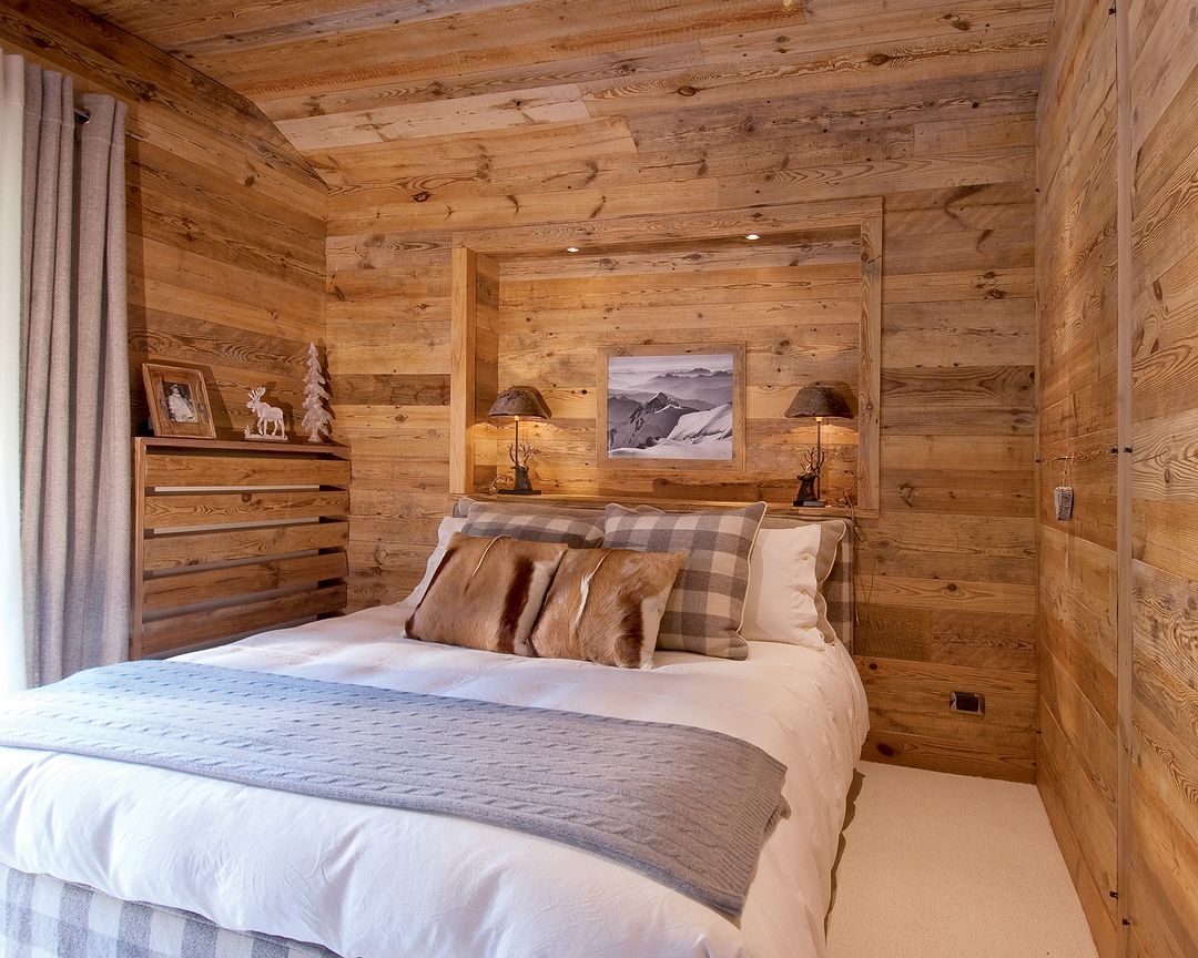 A cozy bedroom retreat with warm wooden paneling