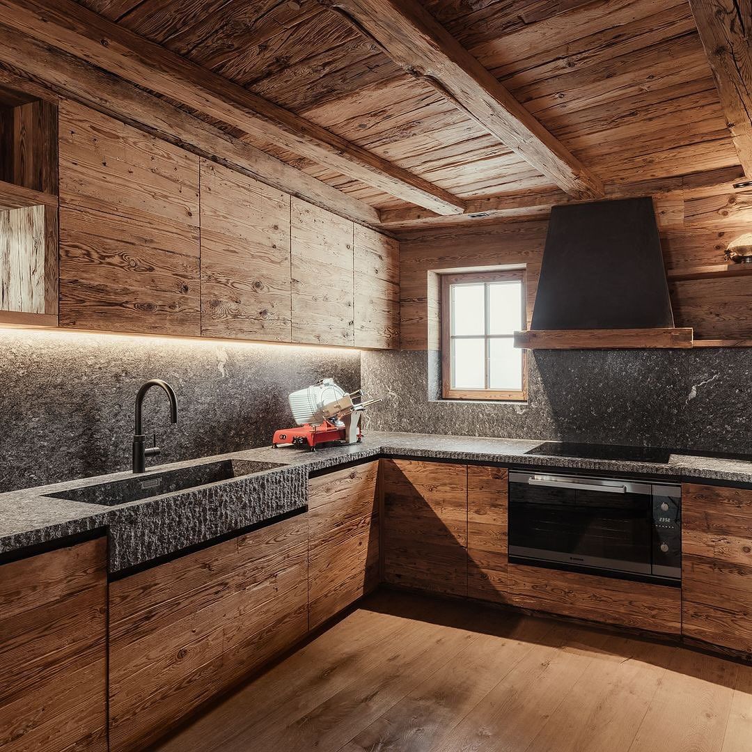 Rustic wooden kitchen with stone countertops