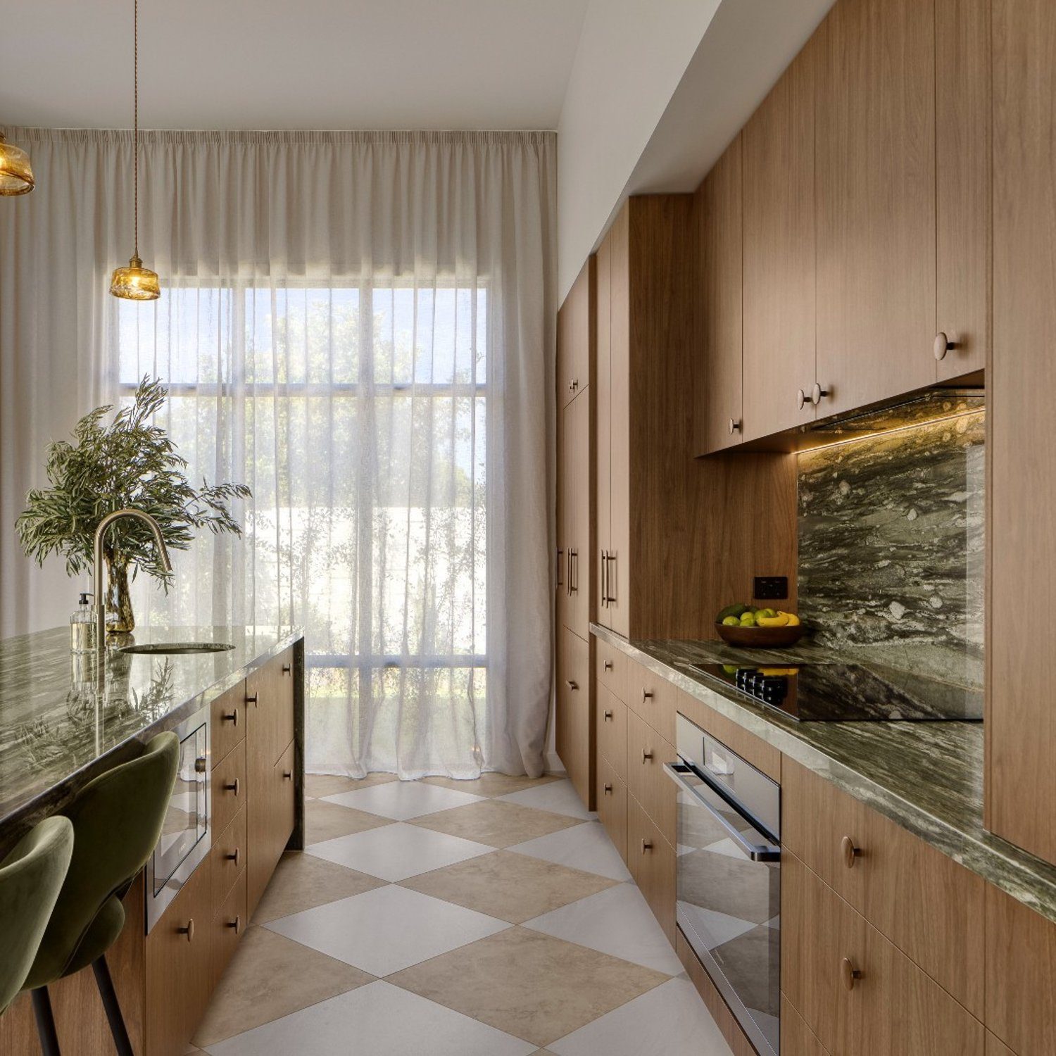 A modern kitchen featuring light wood cabinetry, a green marble countertop, and geometric patterned flooring.