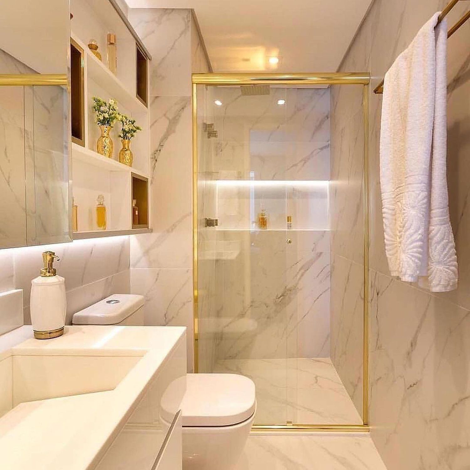 Elegant marble bathroom with gold accents