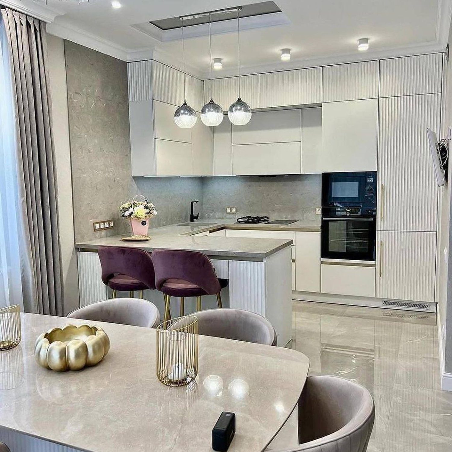 Elegant contemporary kitchen featuring plush velvet stools