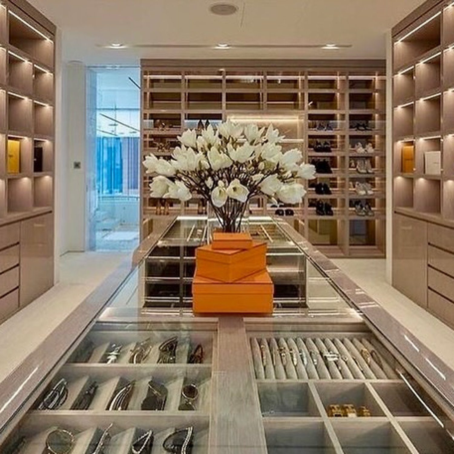 Luxurious walk-in closet with strategic lighting