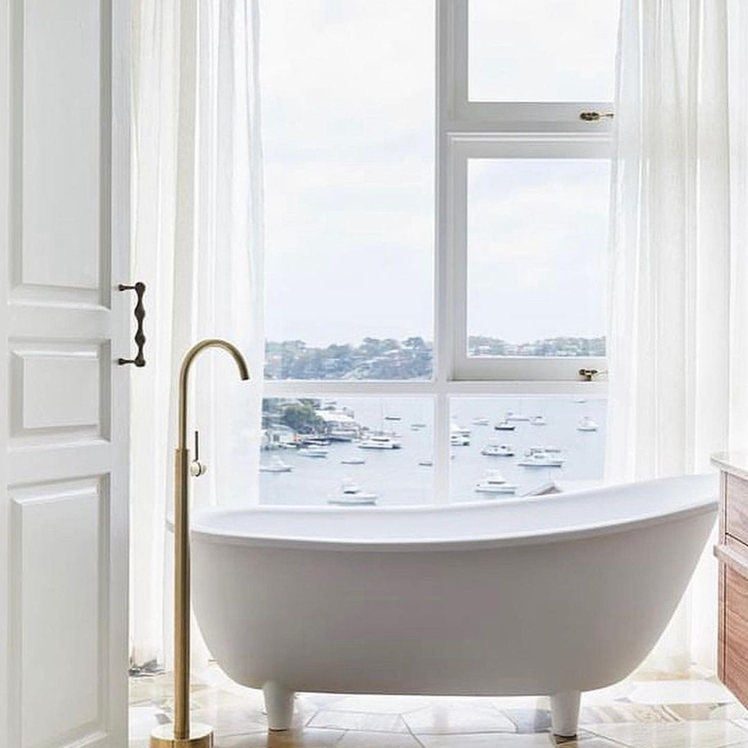 Luxurious freestanding bathtub with a scenic view