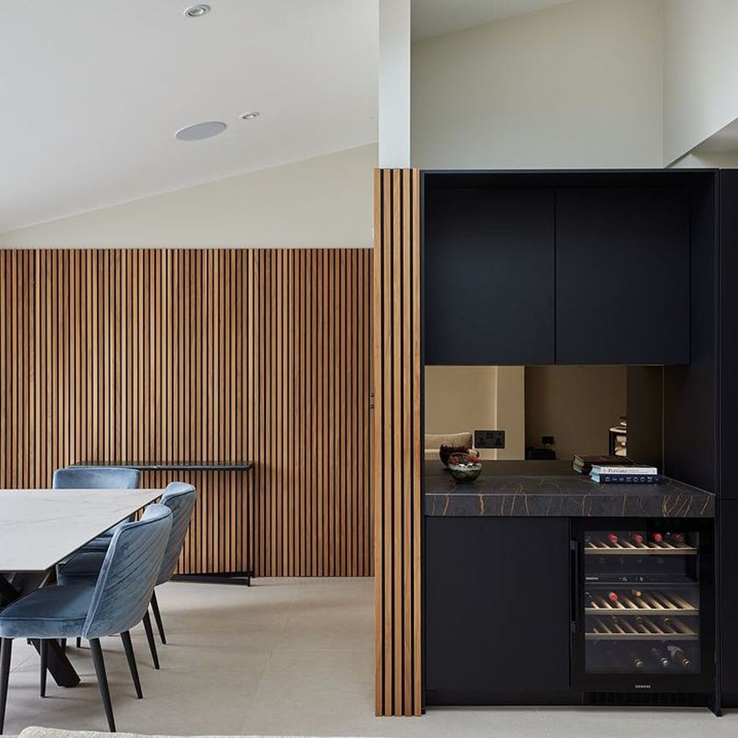 A modern and elegant dining and kitchen area