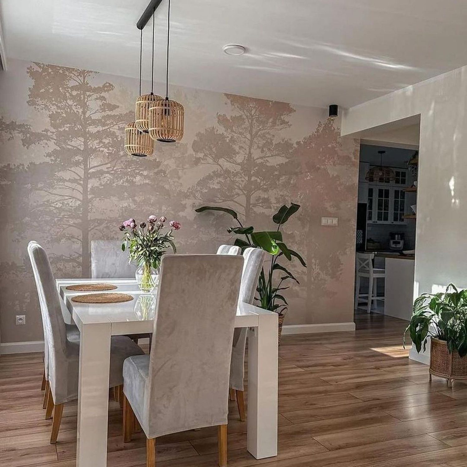 Elegant dining area with forest-themed wallpaper