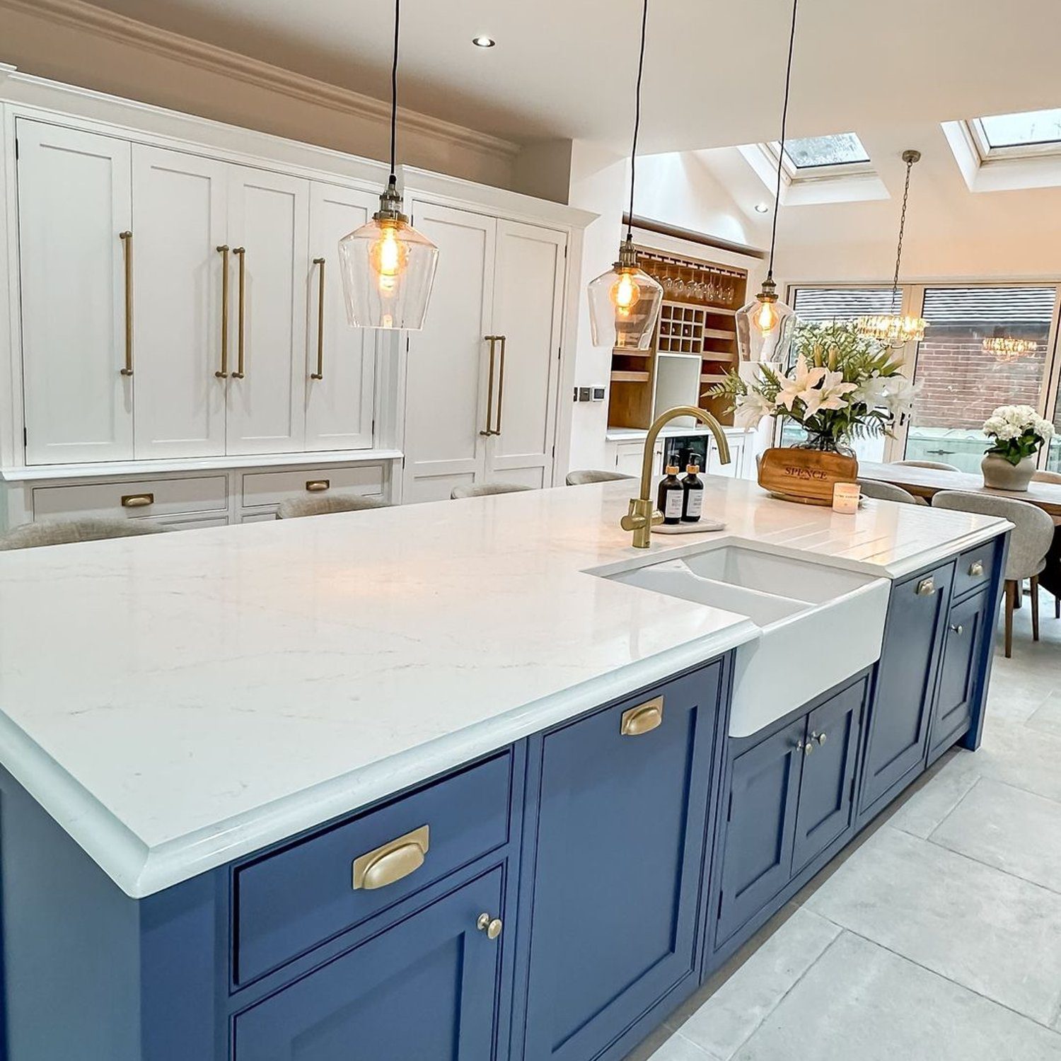 Elegant dual-tone kitchen with a marble countertop