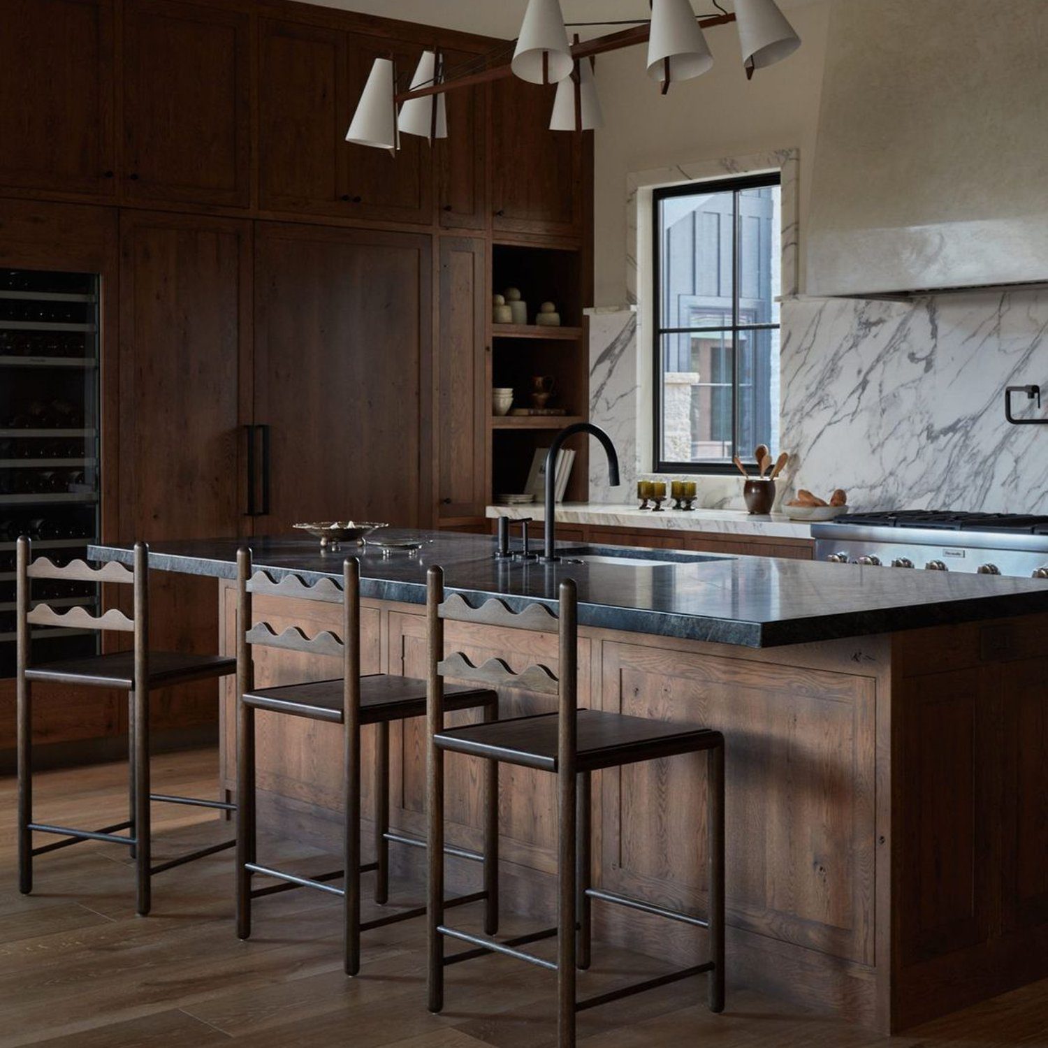 Elegant wooden kitchen with marble accents