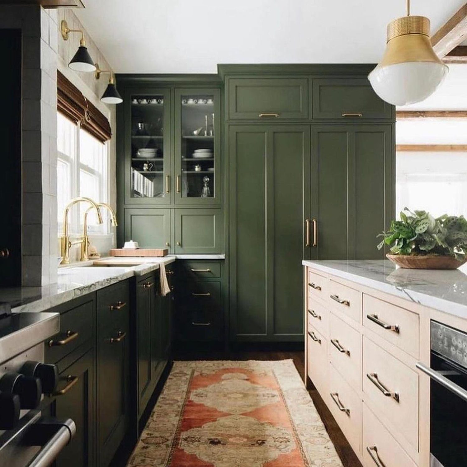 Elegant green and beige kitchen with a traditional touch