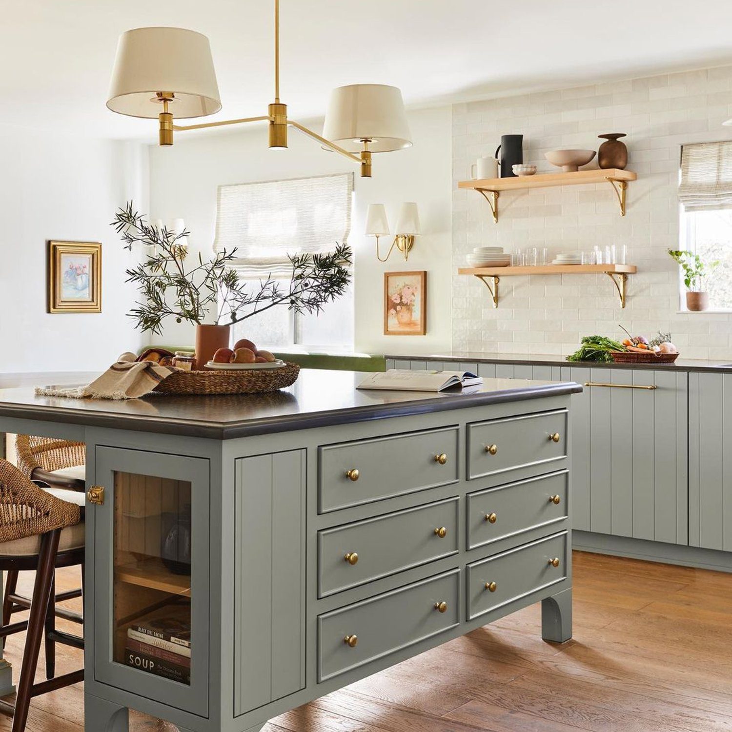 A tastefully designed kitchen with a blend of traditional charm and modern chic