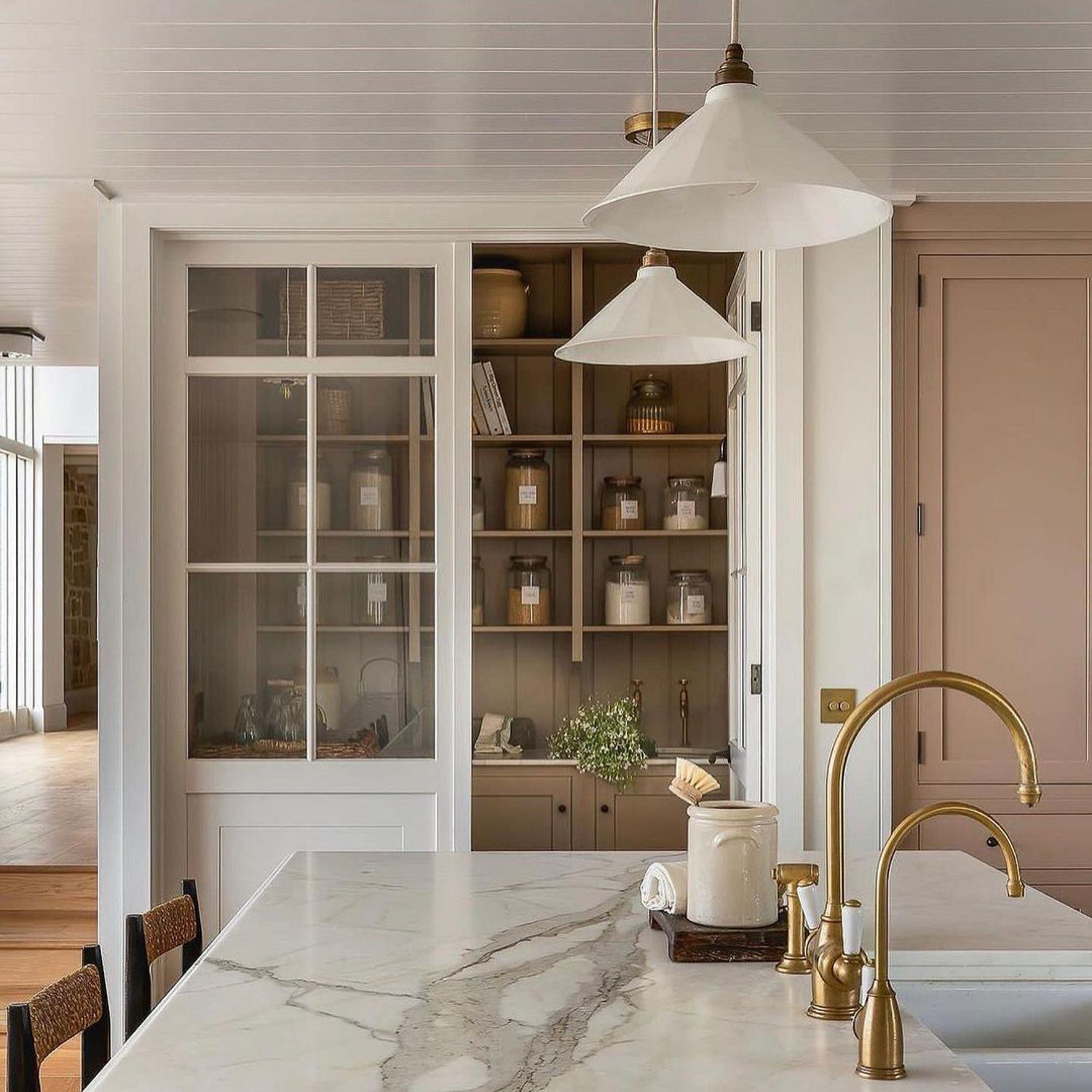 Elegant kitchen with marble countertop and brass accents