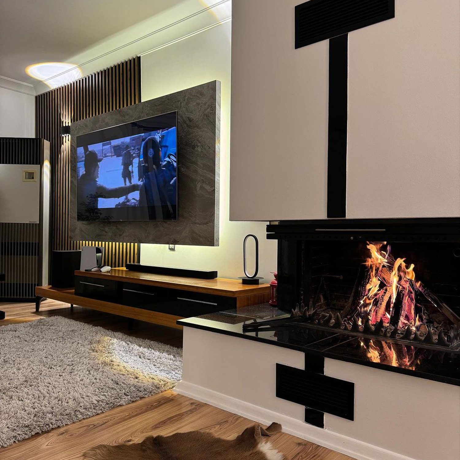 Elegant modern living room with a sleek fireplace and striking black decor