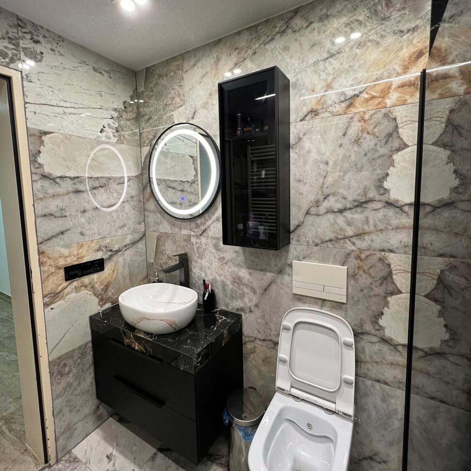 Elegant marble tiled bathroom with modern fixtures