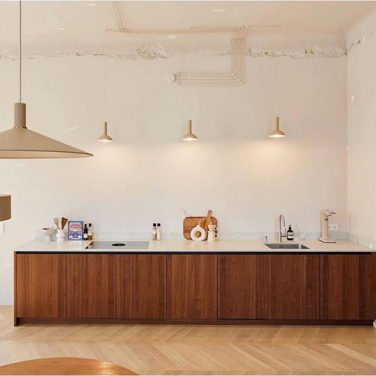 Elegant minimalist kitchen with warm wood cabinetry