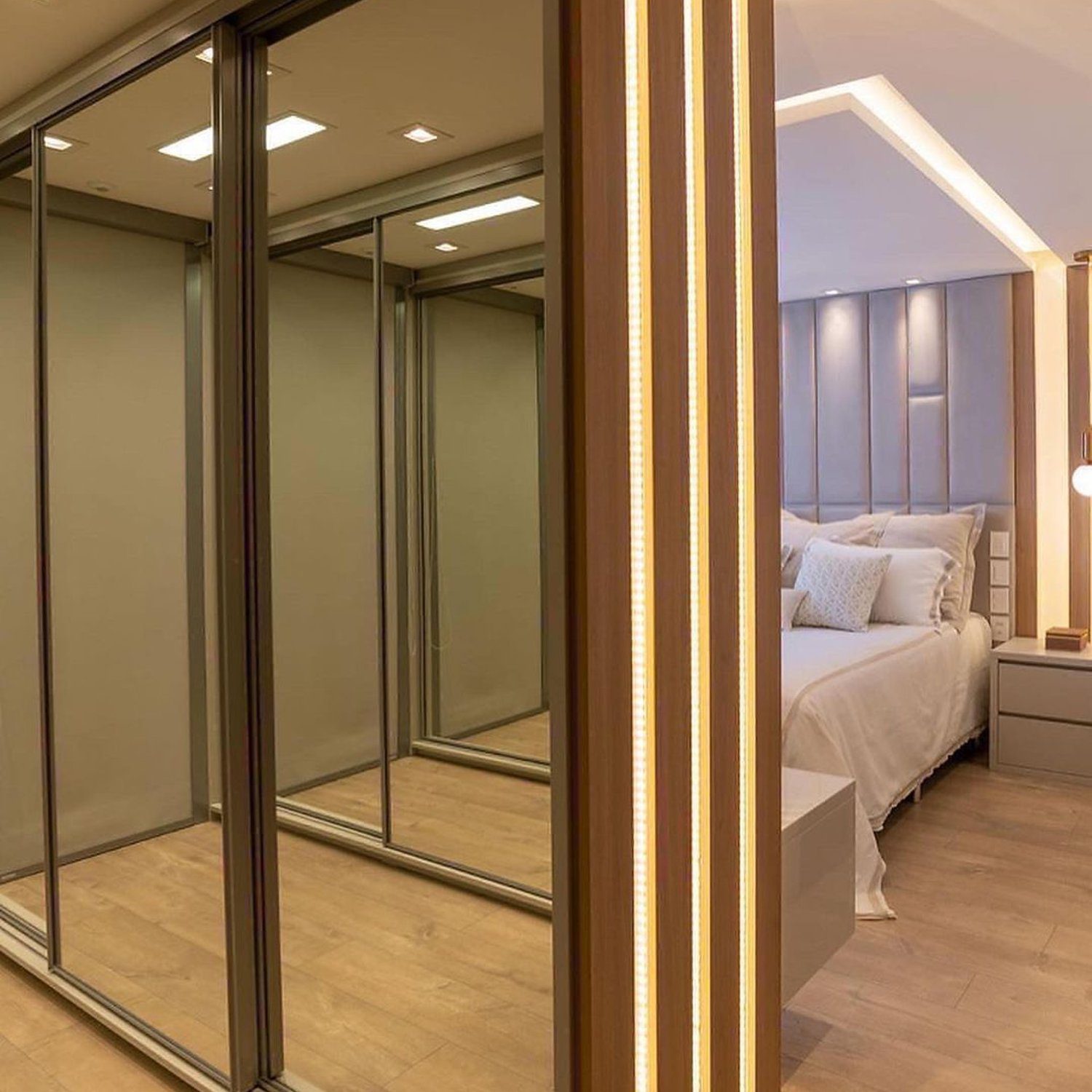 Elegant bedroom with mirrored wardrobe