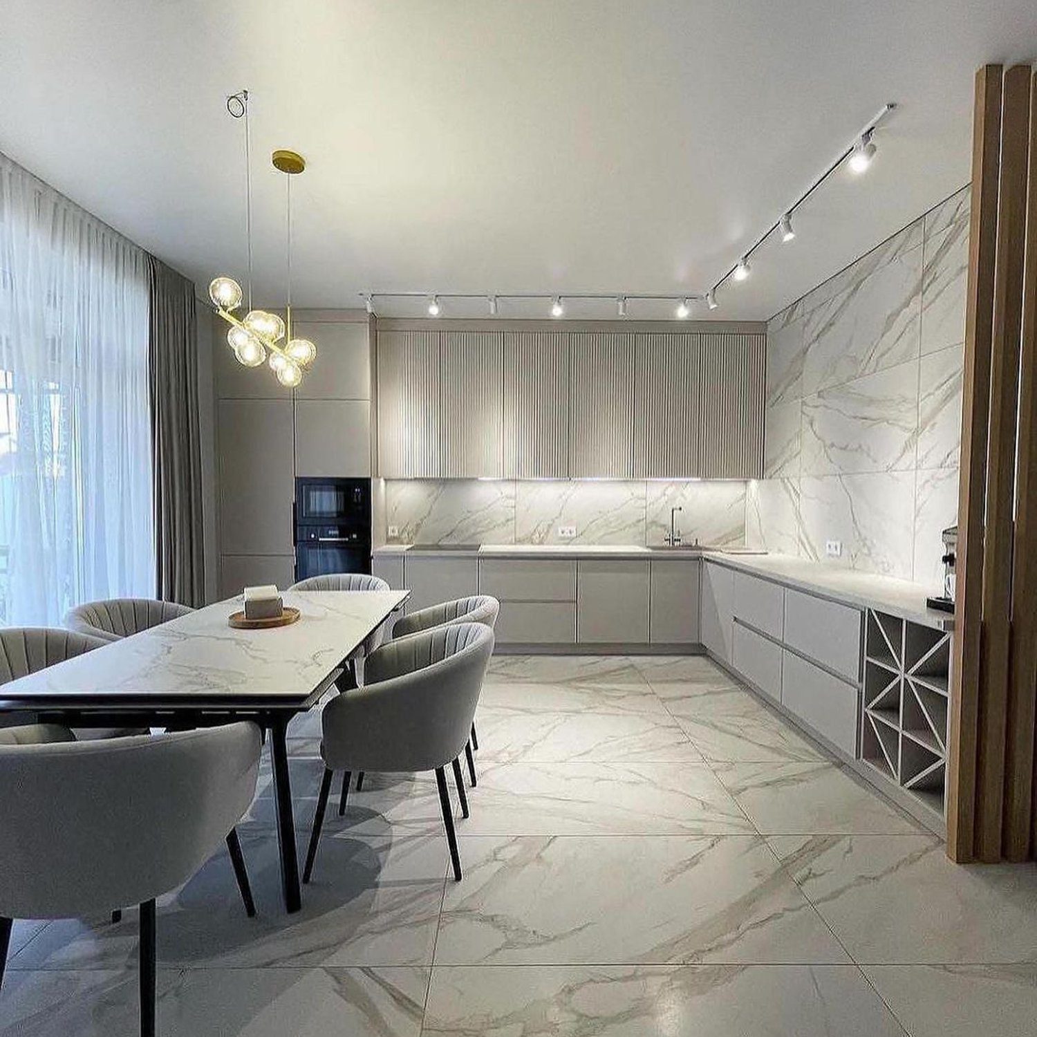 Elegant modern kitchen and dining area with marble details