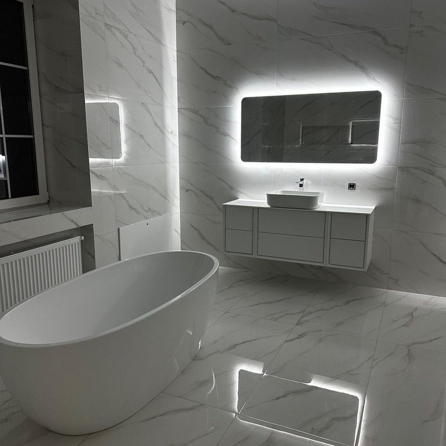 Elegant monochrome bathroom with free-standing bathtub