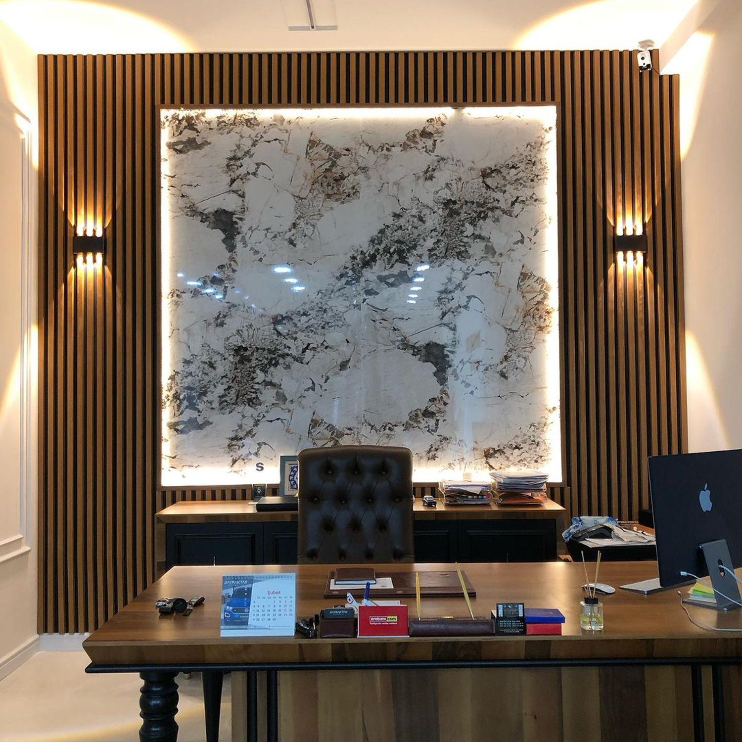 An elegantly-styled office with an oversized map-art piece as a focal point