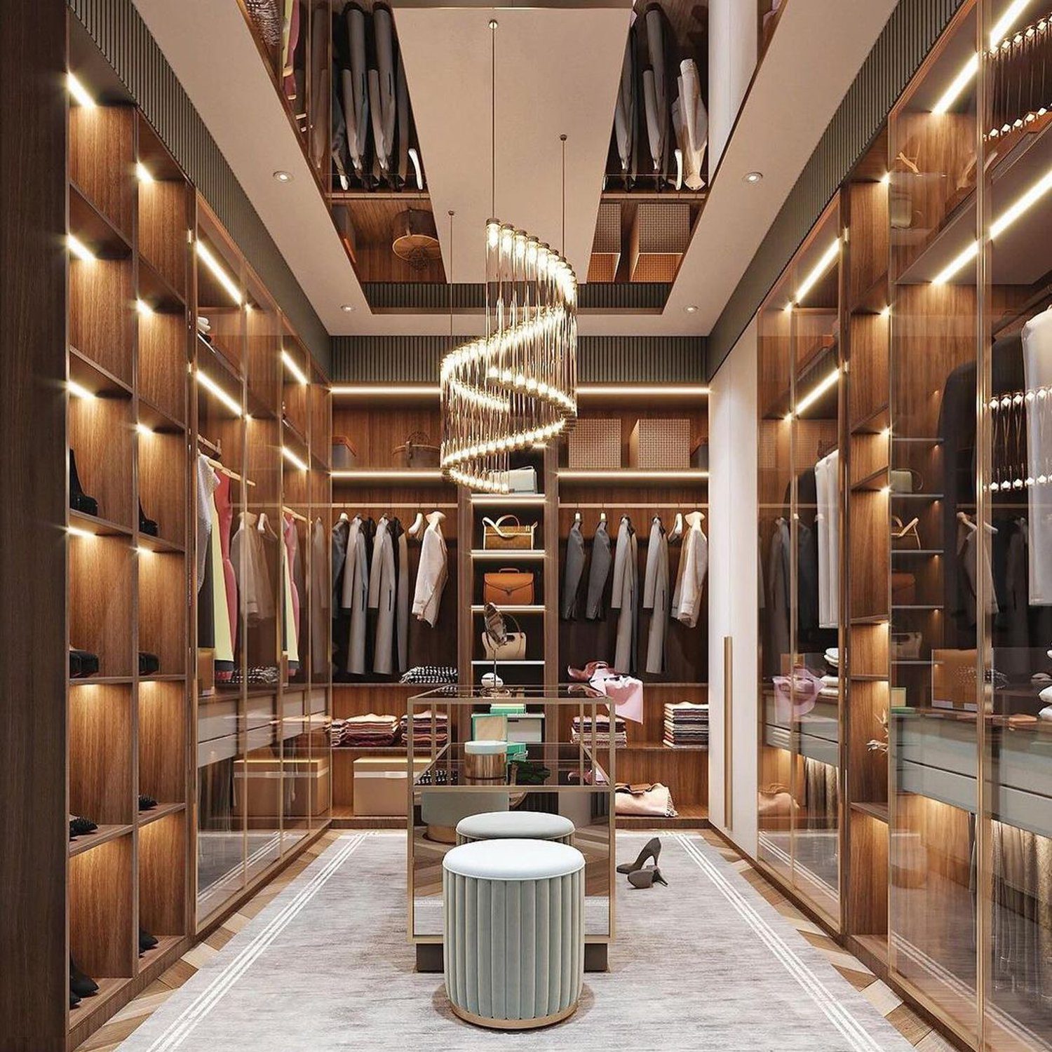 A luxuriously appointed walk-in closet with custom cabinetry and elegant lighting