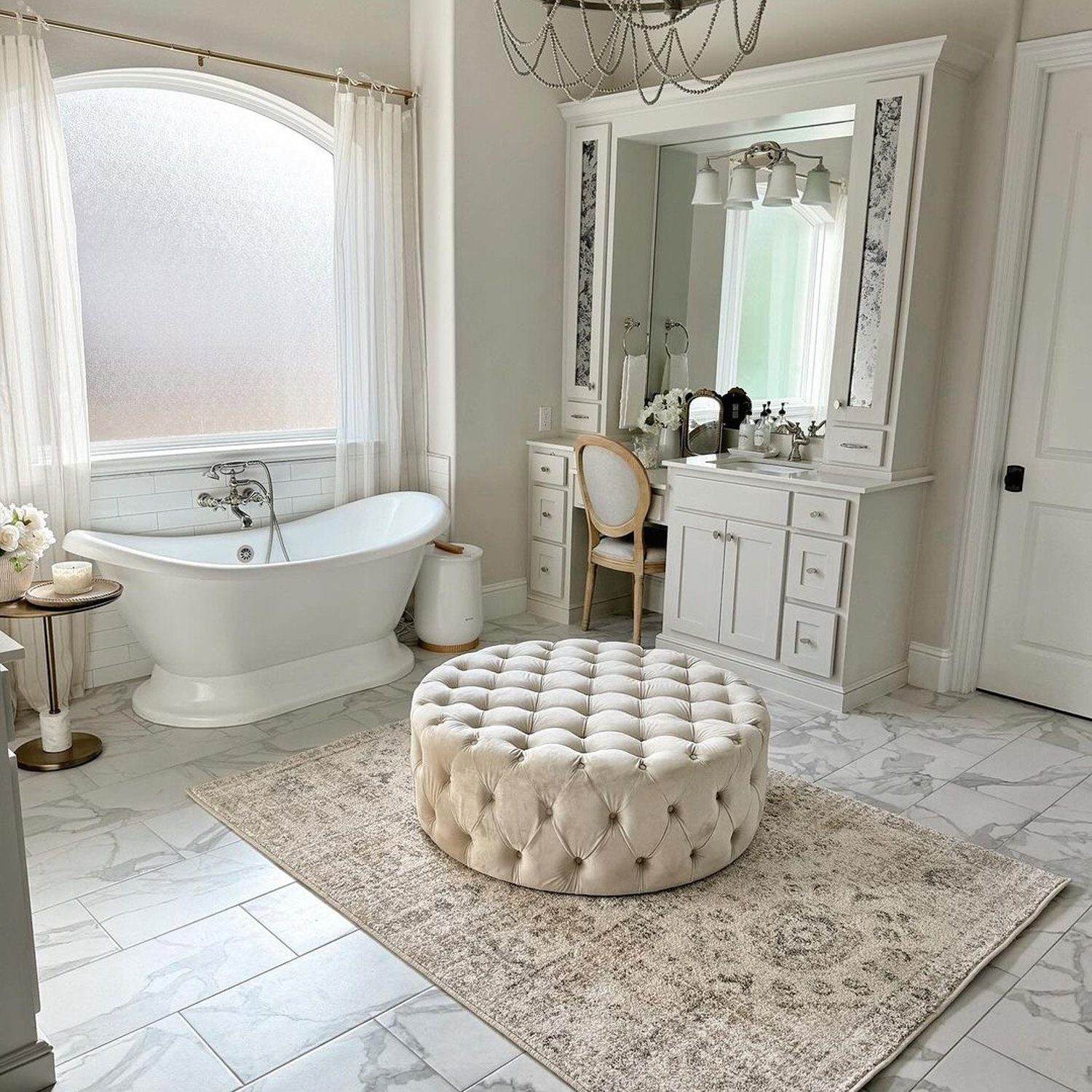 Elegant white and marble bathroom with freestanding tub