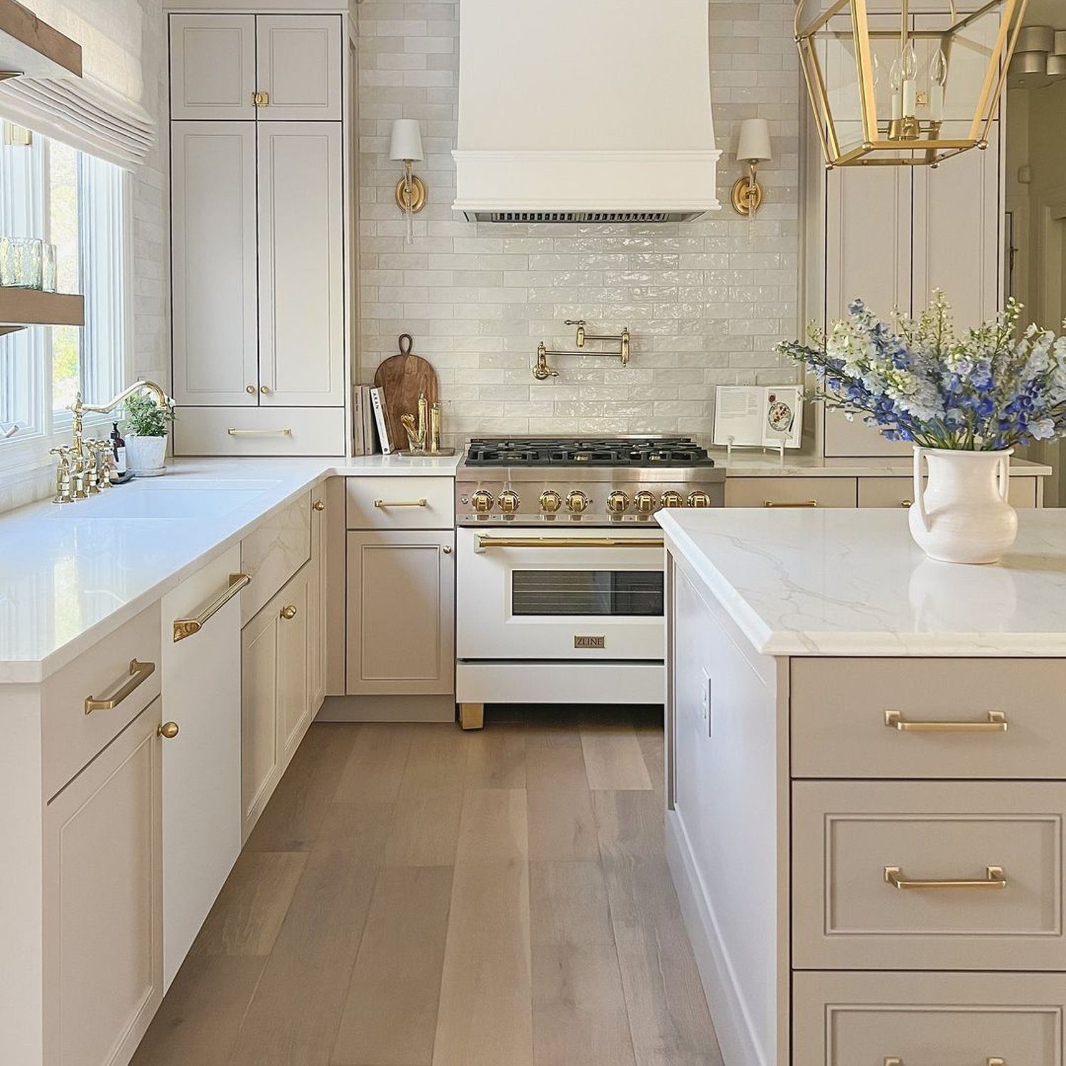 Elegant white kitchen with gold accents