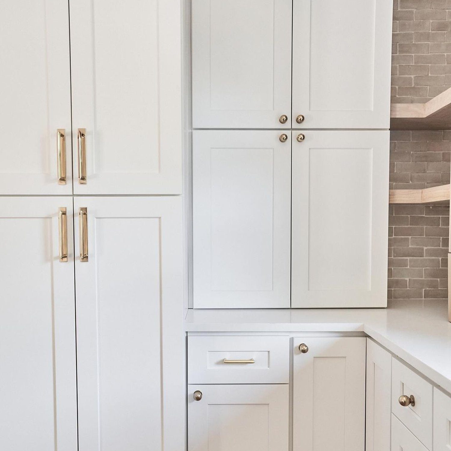 Elegant white kitchen cabinetry with stylish hardware