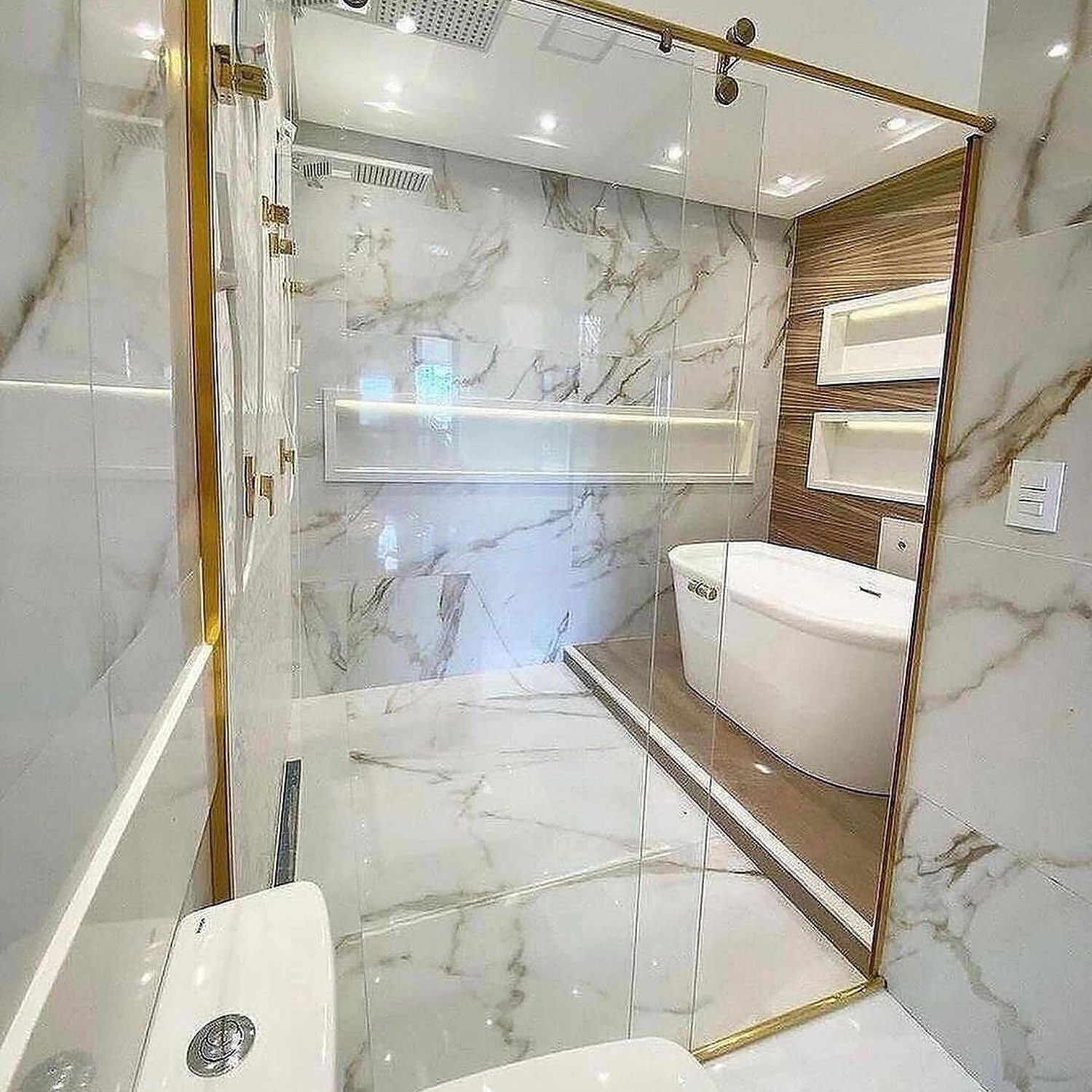 Elegant white marble bathroom with gold accents