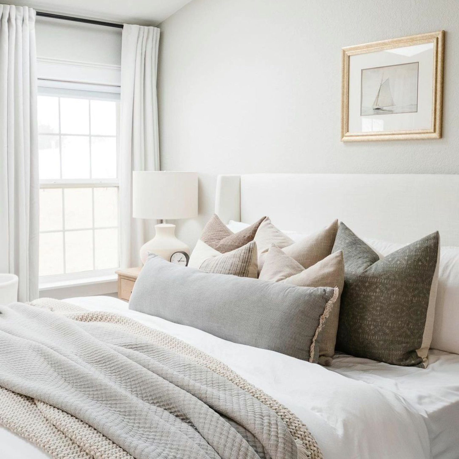 Elegantly styled bedroom with neutral tones