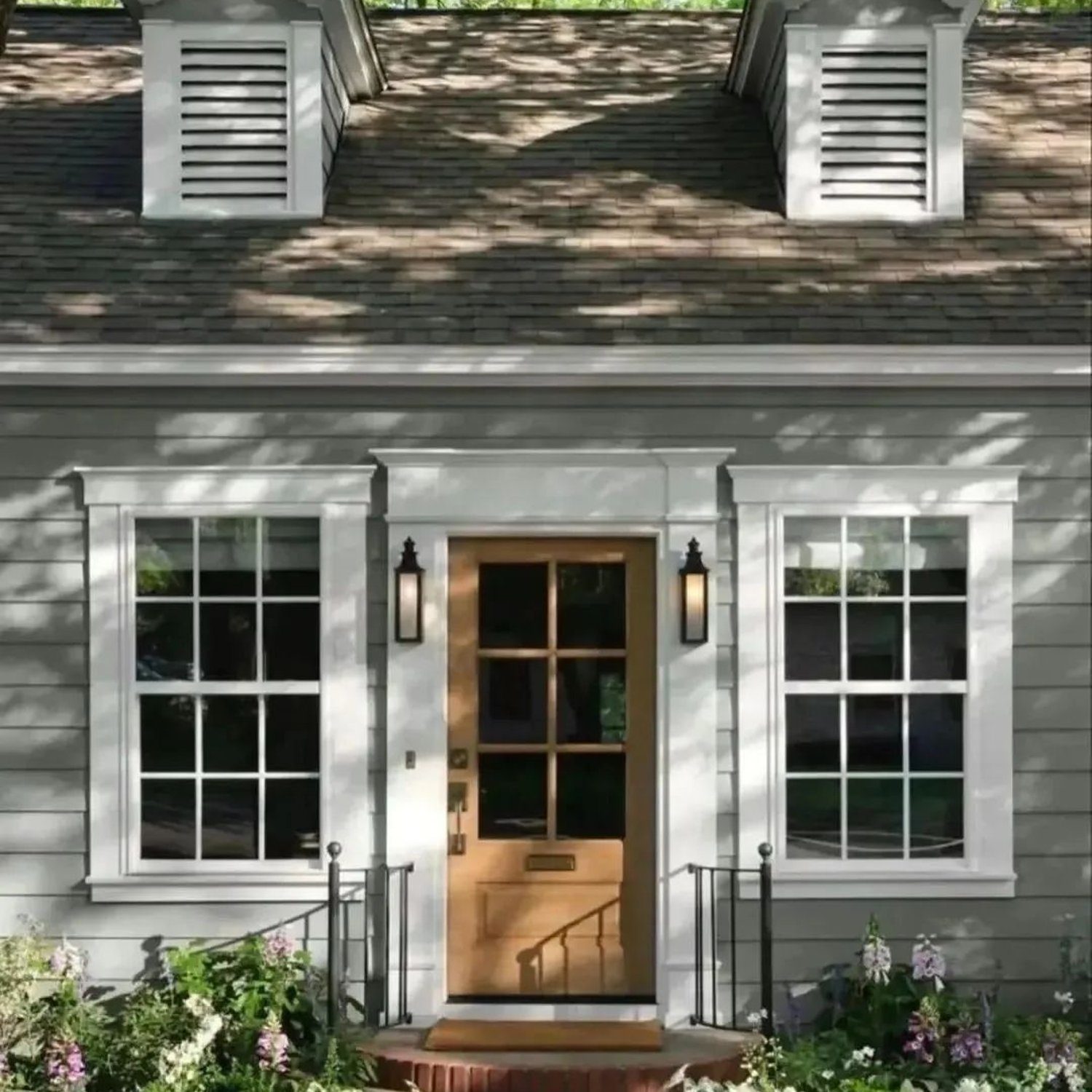 Charming gray house with dormer windows