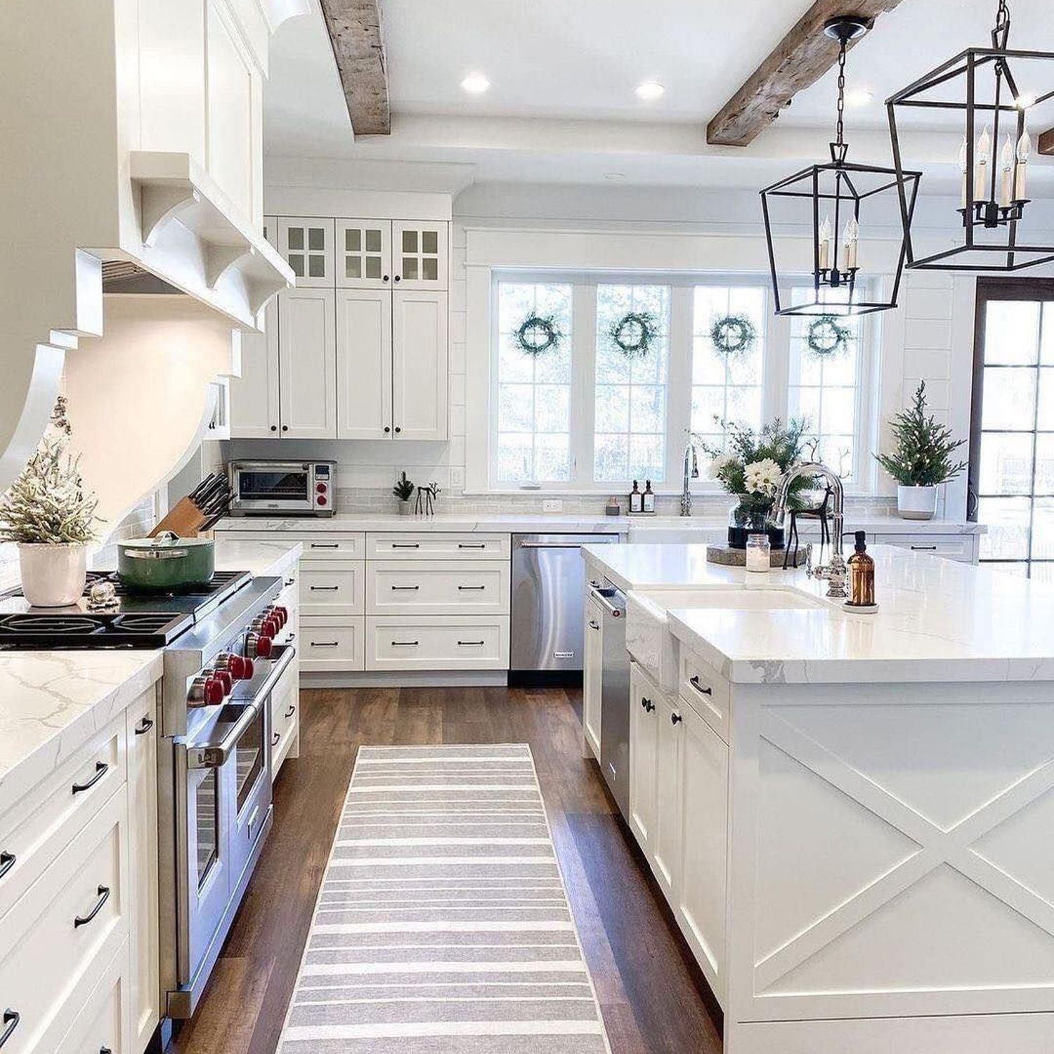 A bright and inviting farmhouse style kitchen with rustic wooden beams