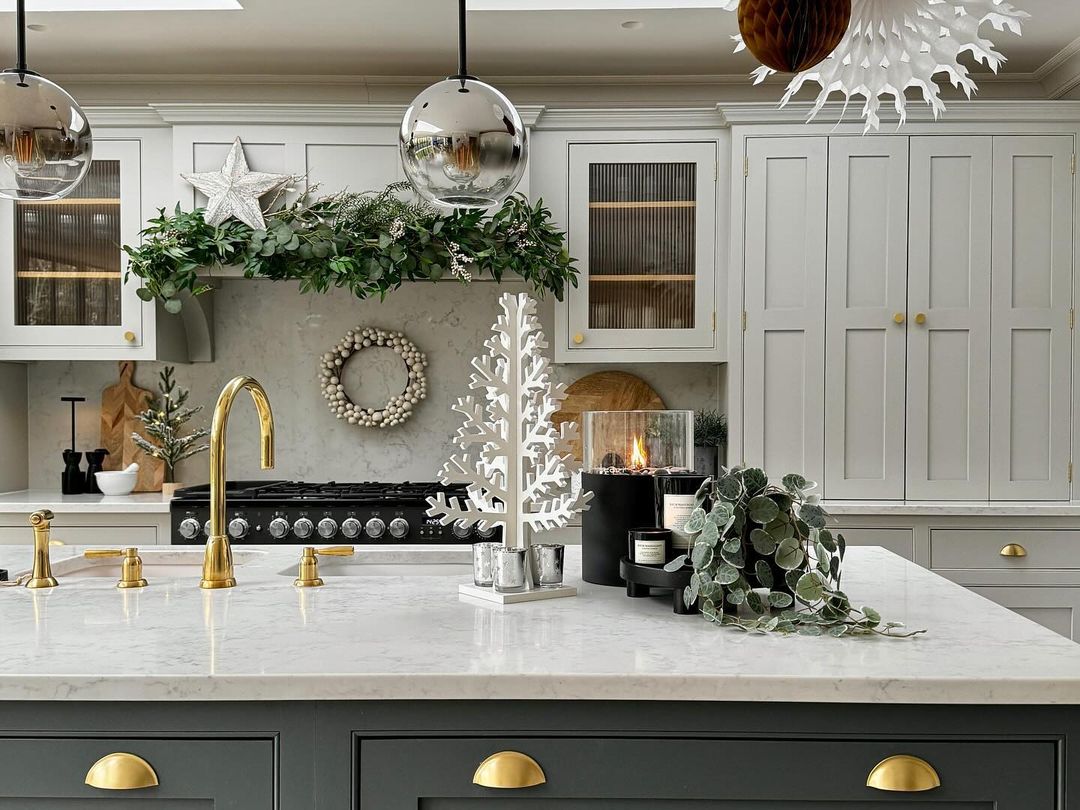 A tastefully decorated kitchen showcasing holiday cheer with a mix of textures and natural elements