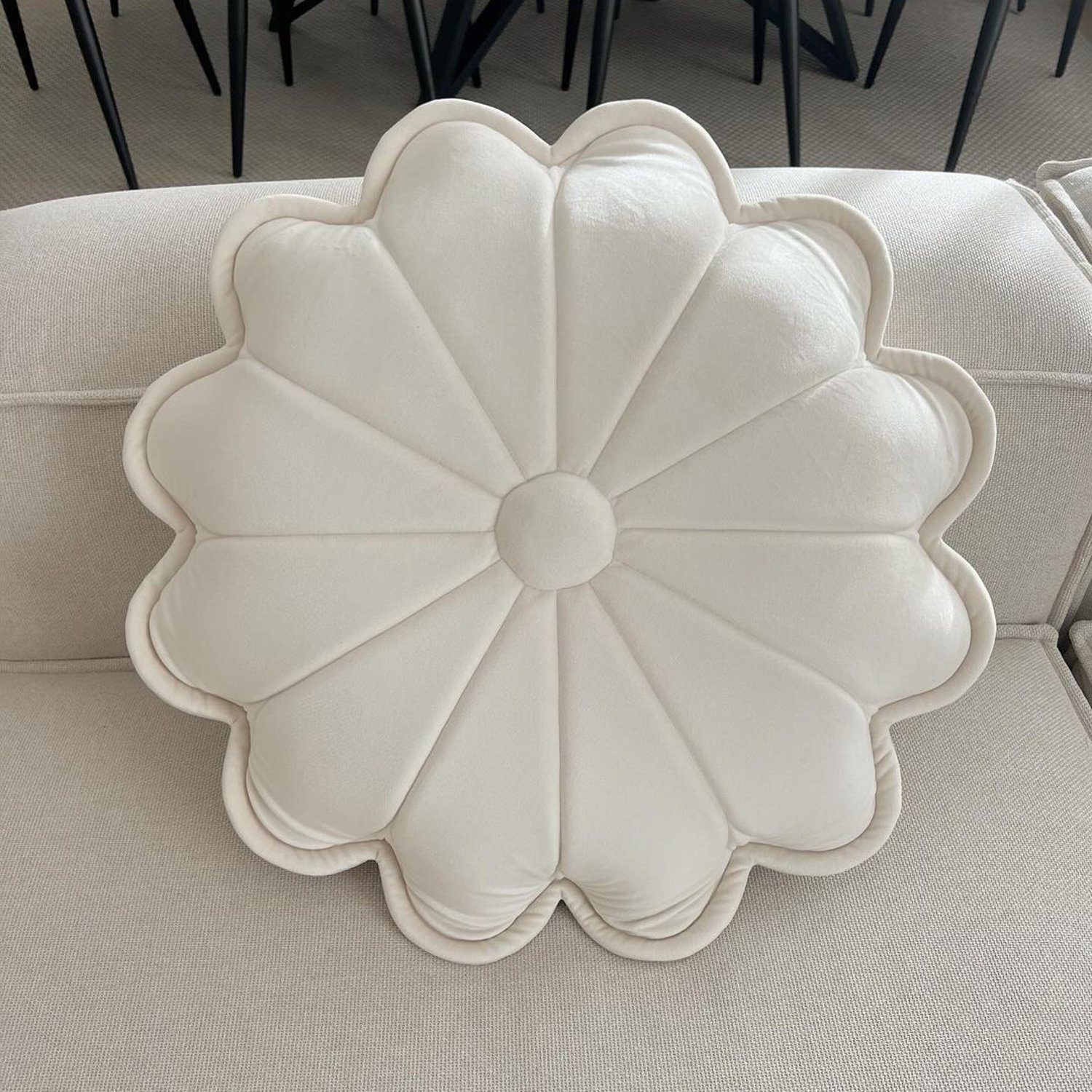 A unique cushion shaped like a flower