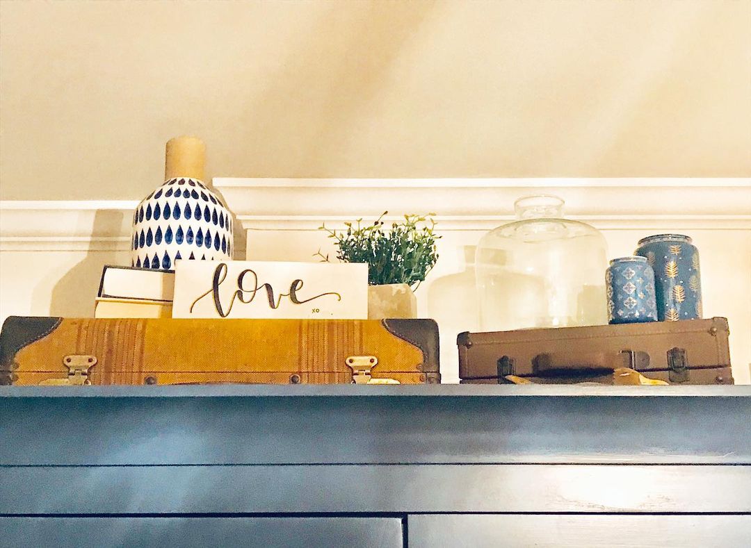 A tastefully arranged shelf with decorative items