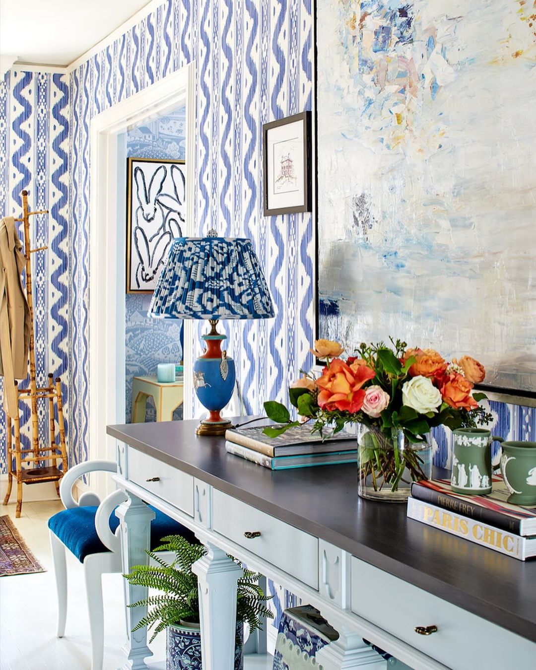 A vibrant home office corner boasting a dynamic mix of patterns and colors