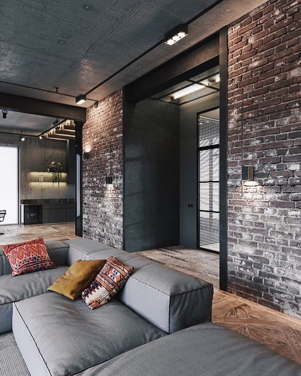 Industrial-style living room with exposed brick and concrete