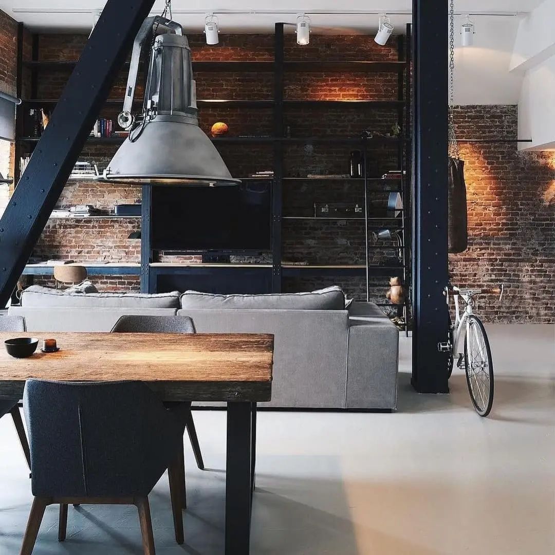 A chic industrial-style living area with exposed brick walls and modern furnishings