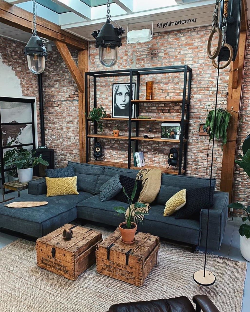 Stylish industrial loft living room featuring exposed brick walls and wooden beams