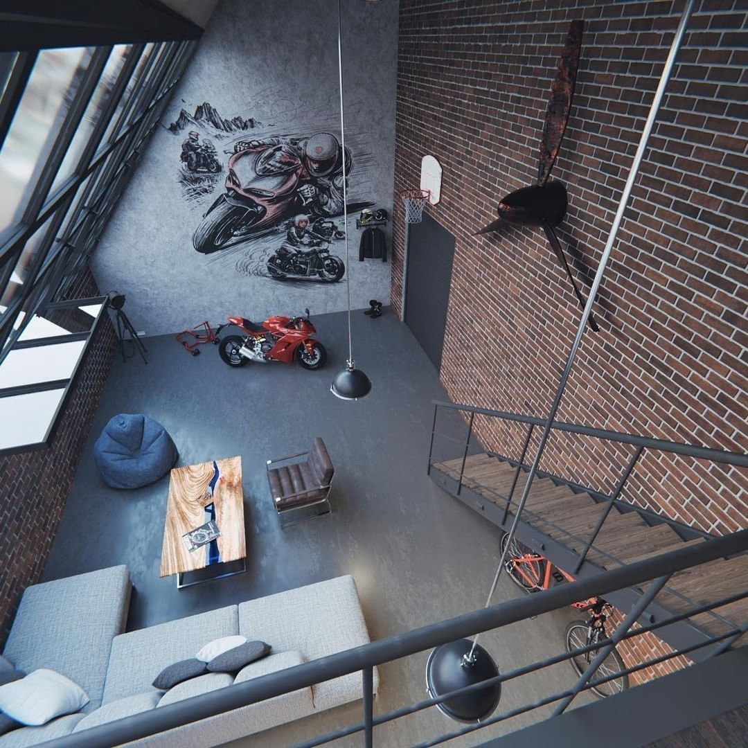 A modern industrial-style loft featuring exposed brick walls and motorcycle-themed decor