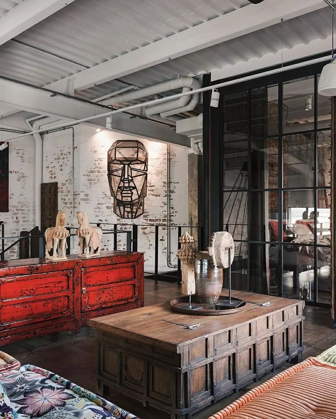 Industrial style living space featuring a blend of vintage and modern decor