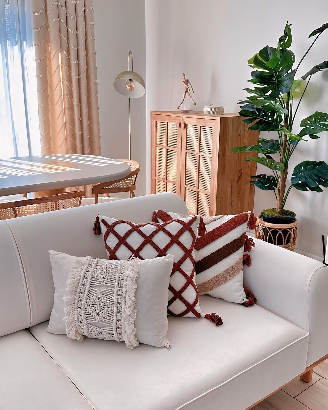 A tastefully arranged living room with an emphasis on natural light and textures