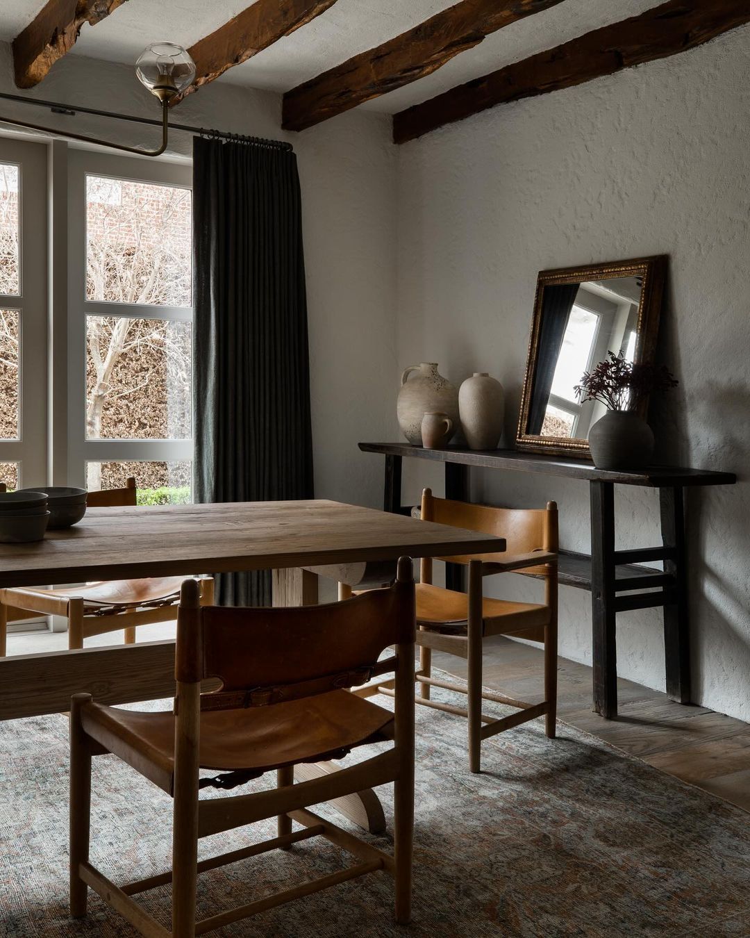 Rustic dining space with exposed wooden beams