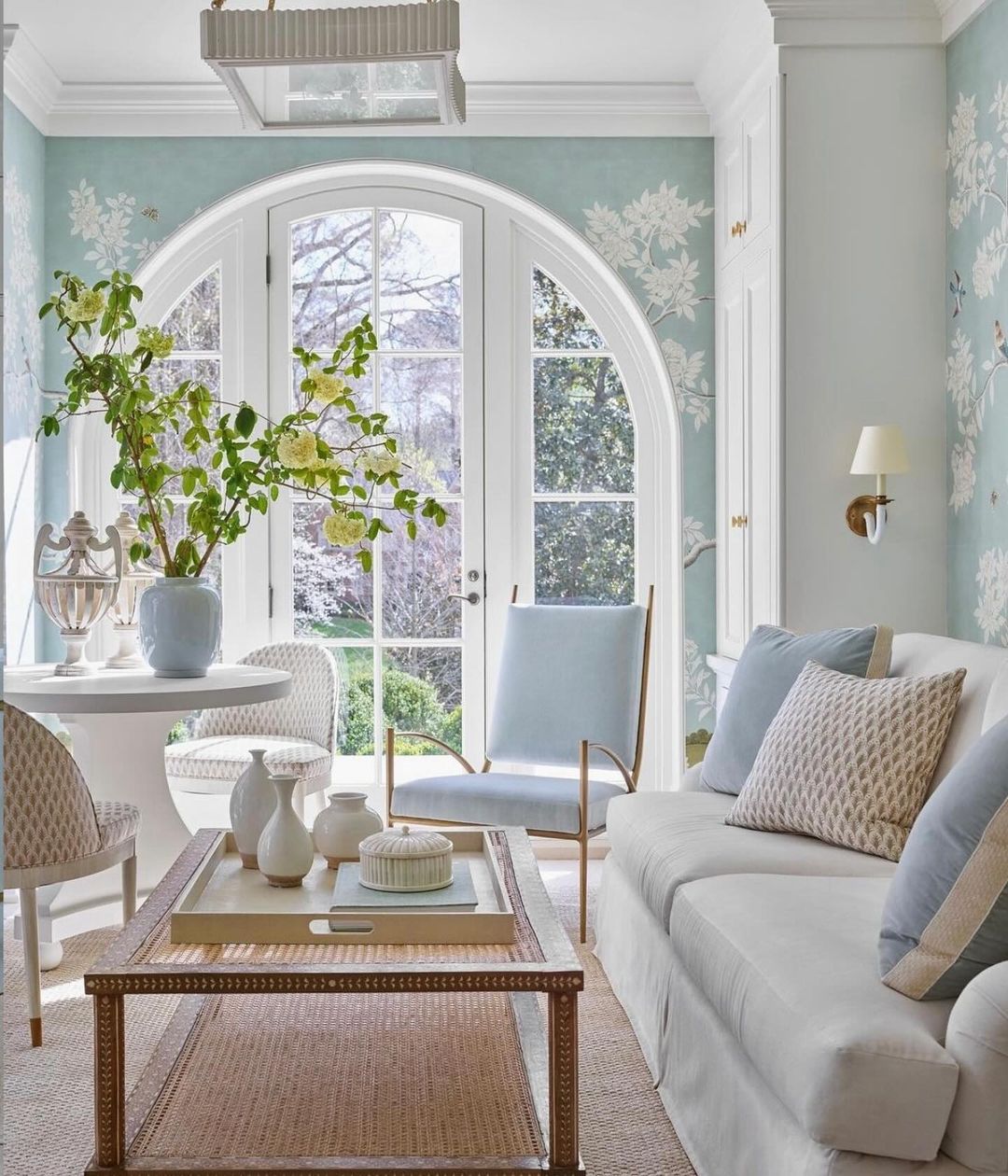 A serene and inviting living room with arched windows