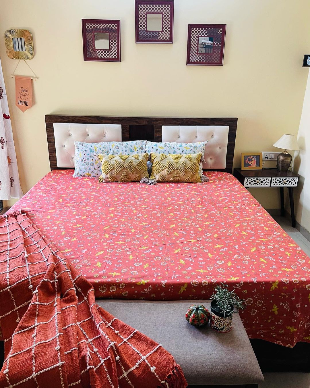 Cozy bedroom with a vibrant red bedspread