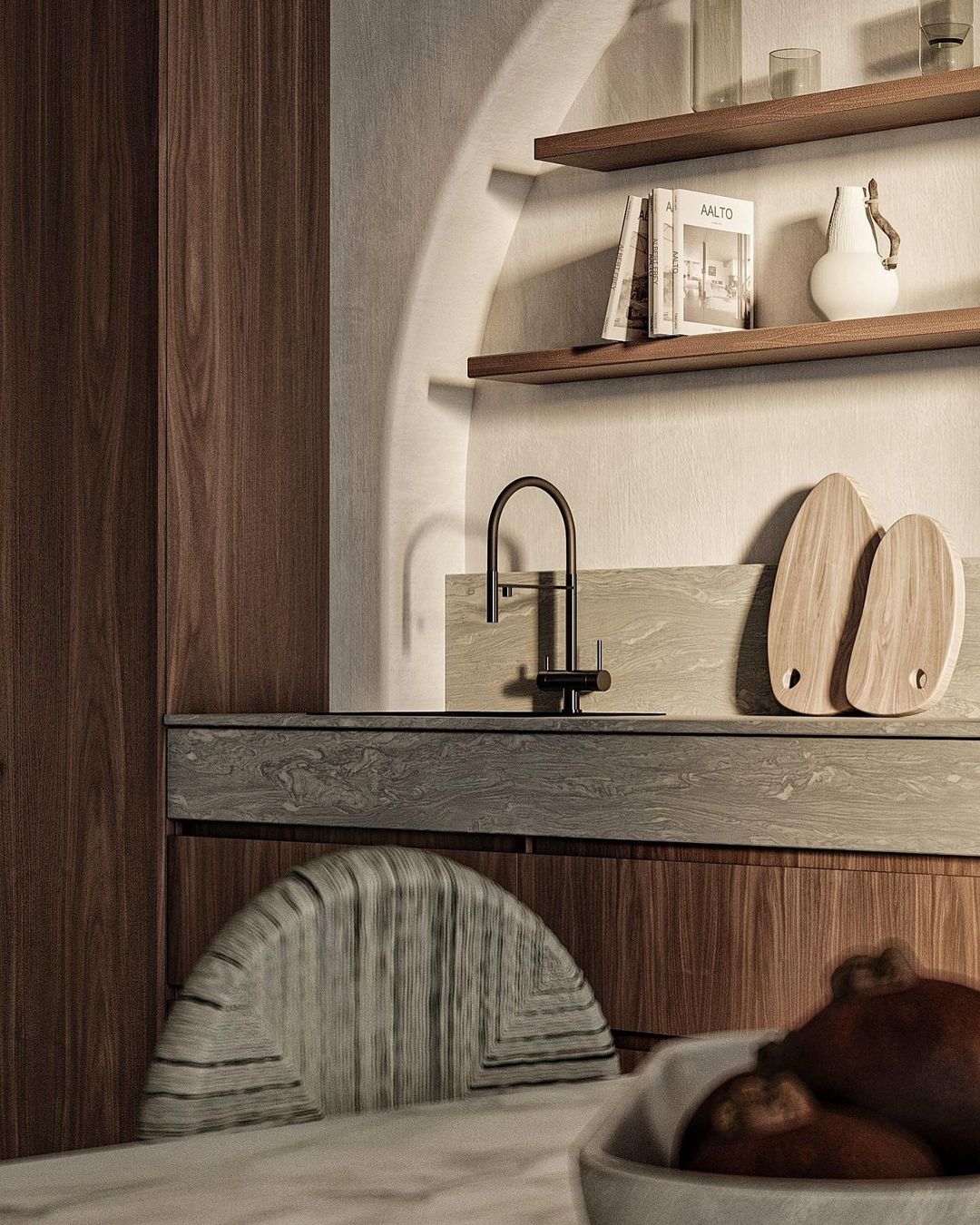 A modern kitchen corner with rich wood tones and marble