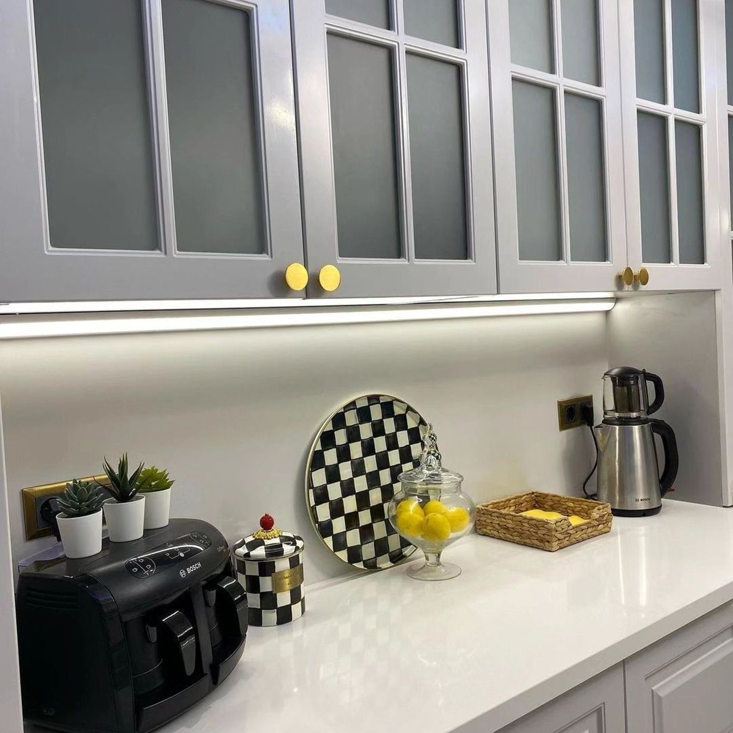 A neatly organized kitchen space with a modern and clean design