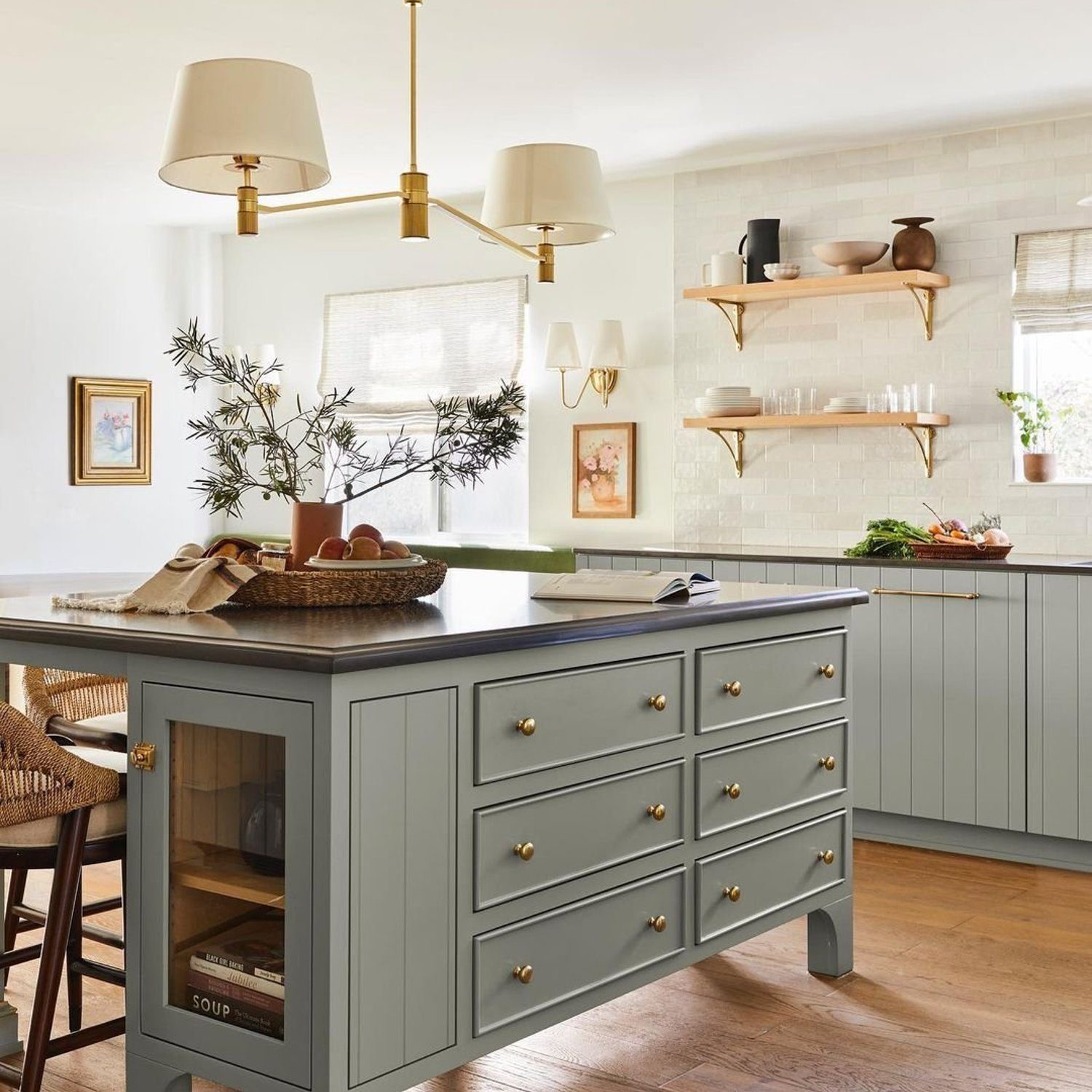 A sophisticated kitchen design featuring an elegant island