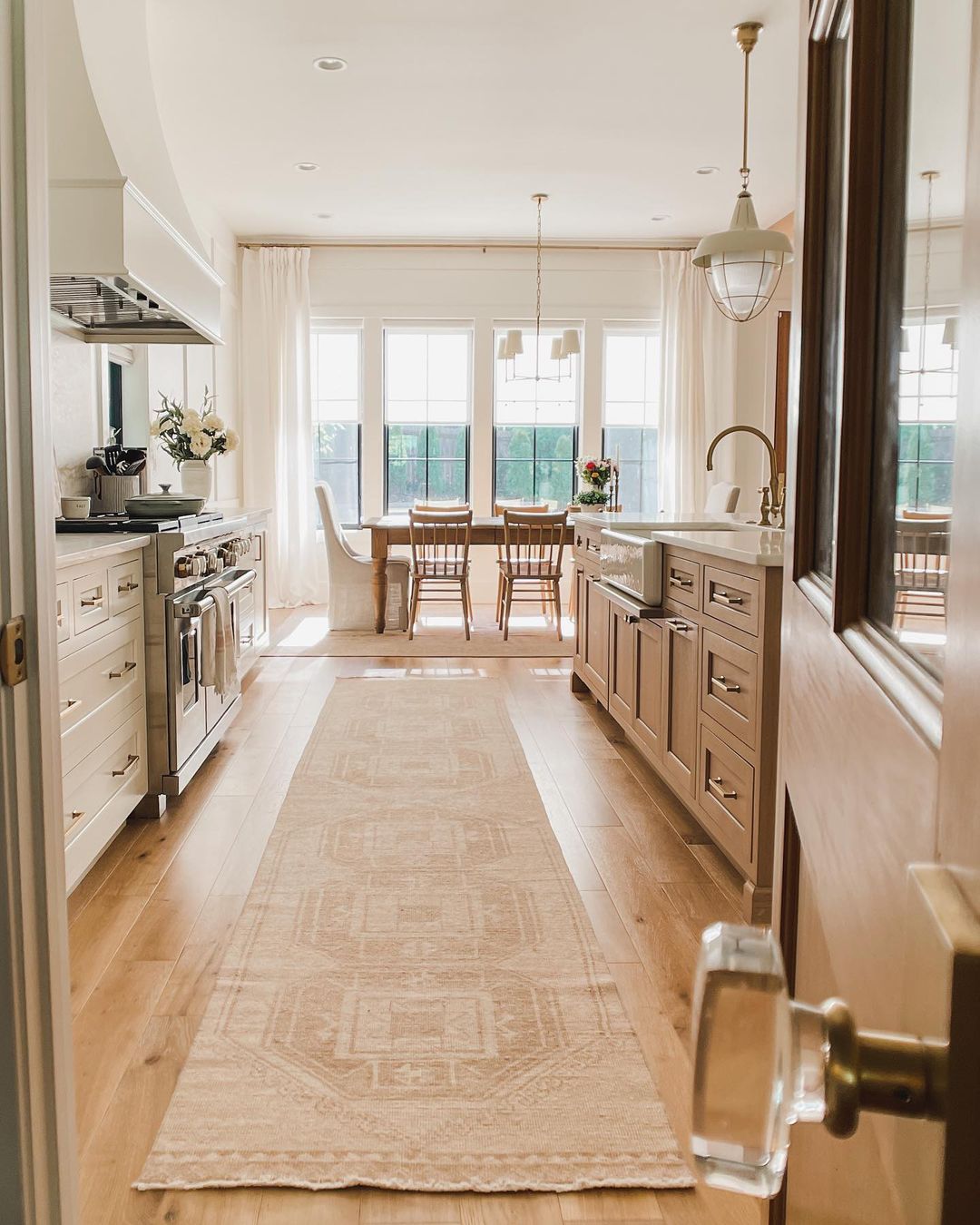 A warm and inviting kitchen featuring understated beige cabinetry